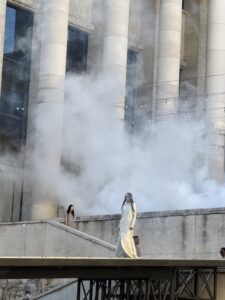Rick Owens SS27 Stone runway crossing the reflecting pool at the Palais de Tokyo through fountain mist